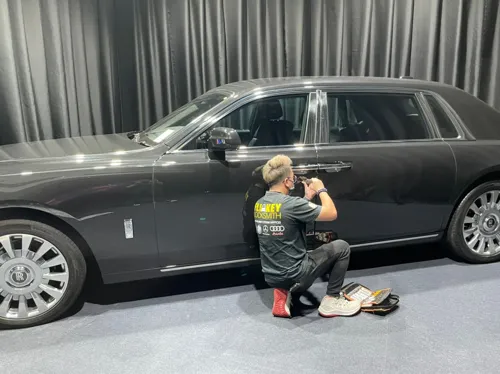 Locksmith working on a car door