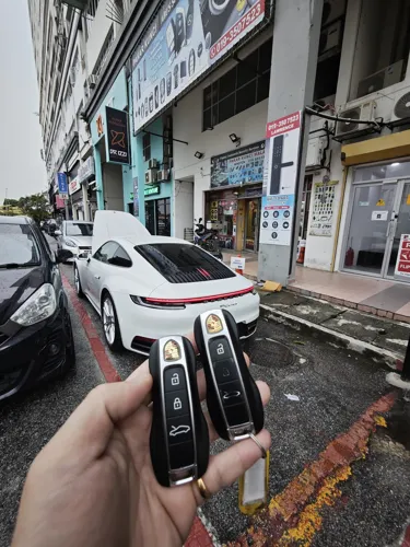 Car keys beside a car